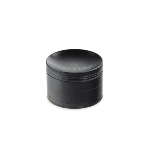 Introducing the 63mm Tsunami Caved Top 4pc Grinder, a sleek and compact cylindrical grinder with a smooth matte black finish. It features an engraved logo and text on the top, making it an ideal portable grinder for small items.