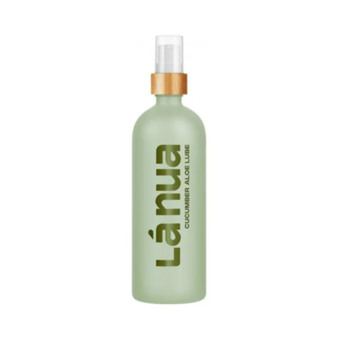 A 6.8oz green bottle labeled Cucumber Aloe Water Based Lubricant, featuring a wooden cap and white pump dispenser, elegantly stands against a white backdrop. Its vertical text highlights its dual role as a lubricant and natural moisturizer for optimal com