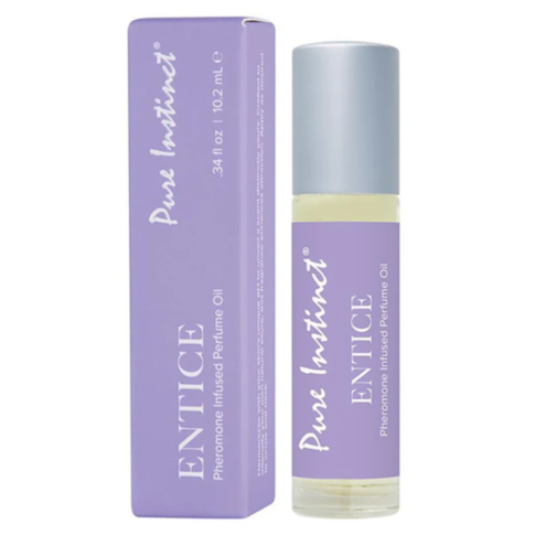 A bottle of Pure Instinct Entice pheromone oil, featuring a sensual sandalwood amber fragrance, comes in a light purple 0.34 fl oz (10.2 mL) bottle and box adorned with white text, perfectly capturing the allure within.