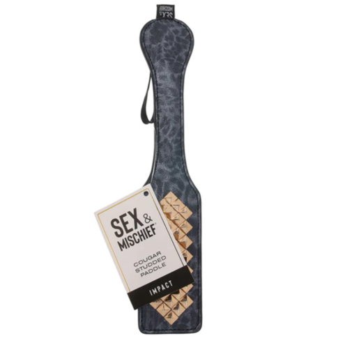 The Cougar Studded Paddle features a black faux leather design, enhanced with a leopard print pattern and gold studs.