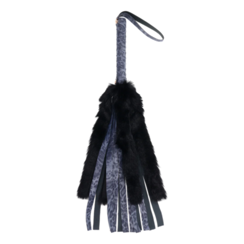 Introducing the Cougar Faux Fur Flogger: a chic and sumptuous tool designed for sensual exploration. It features a leopard print handle adorned with plush faux fur accents, while elegant leather strands extend from the grip, blending textures to create a 