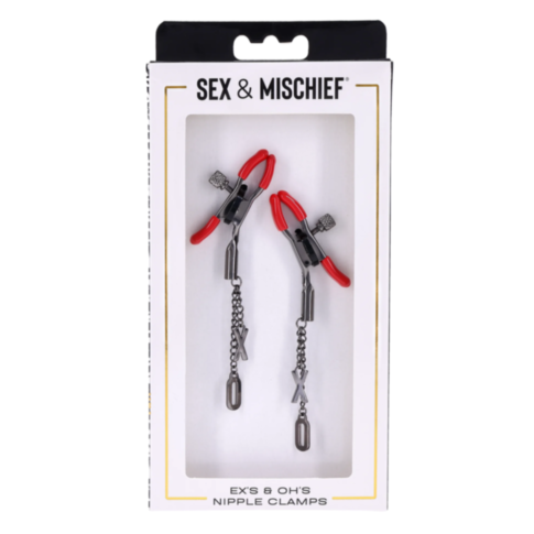 The Exs & Ohs Nipple Clamps feature adjustable tension metal clamps with red tips, connected by chains decorated with silver X and O charms, all packaged as part of the Sex & Mischief collection.
