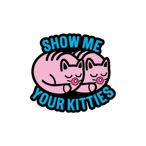 The "Wood Rocket-Show Me Your Kitties Pin" features an illustration of two pink cats sleeping with their tails curled and is accompanied by playful text "Show Me Your Kitties" in bold blue and black letters. This enamel pin from the WoodRocket Porn Pin co
