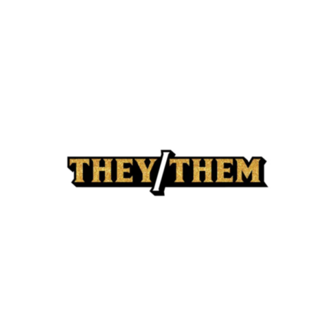 The image features the Wood Rocket-They/Them Pin, displaying the text THEY/THEM in a bold font with a glittery gold texture and a black outline, resembling a chic enamel pin.