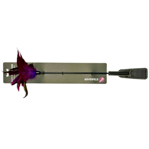 The Starship Feather Slapper features a riding crop with a black handle and flap end, enhanced by purple and red feathers at the top, crafting an enticing balance of pleasure and pain. It is presented in rectangular packaging marked with the STARSHIP labe