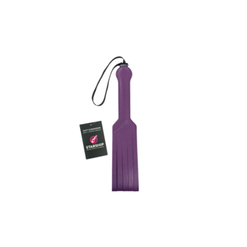 A purple leather Starship Soft Surrender - Split Looped Paddle features a black wrist strap and a tag, displayed against a white background.