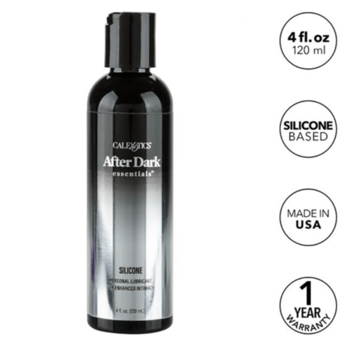 A graphic illustration depicts a rocket launching upward, encircled by a border of stars, with the text "No Image" displayed above. Set against a green background, the minimalist design elements of the After Dark Essentials Silicone Lube 4oz suggest its e