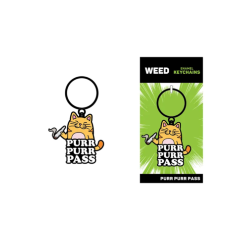 The Wood Rocket-Purr Purr Pass Keychain features a cartoon cat with a mischievous grin holding a curled object, accompanied by the playful phrase "PURR PURR PASS" below. It comes packaged in vibrant green, making it the perfect accessory.