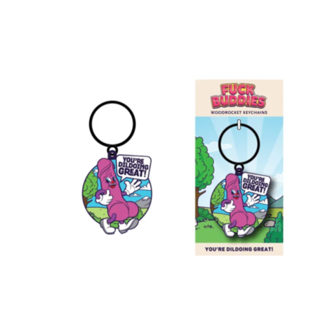 A Wood Rocket-Fuck Buddies-You're Dildoing Great! Keychain showcases a purple animated character with white gloves, set against a scenic backdrop, holding a sign that reads “You’re Dildoing Great!”