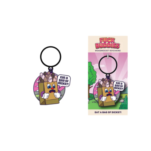 The Wood Rocket-Fuck Buddies-Eat A Bag Of Dicks Keychain is a playful and cheeky accessory, featuring a cartoonish brown paper bag with blue eyes and a humorous sign. It is packaged in vibrant pink and green packaging as part of the Woodrocket Fuck Buddie