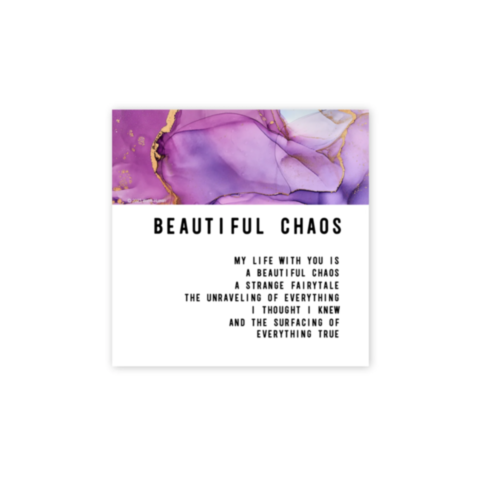 The "Beautiful Chaos Magnet" showcases an abstract alcohol art design with swirling patterns of purple and white. Featuring gold veining accents at the top, it beautifully captures the essence of Ink + Soul. The words "BEAUTIFUL CHAOS" are inscribed, intr