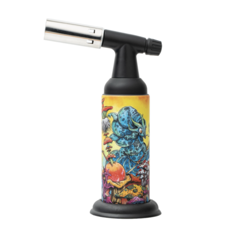 The Special Blue - Monster - Artist Series butane torch features full-metal construction and a vibrant design of a blue caterpillar smoking a hookah among colorful mushrooms and plants on a yellow background.