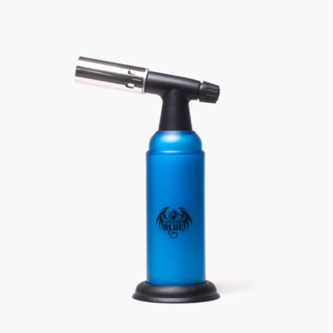 A Special Blue - Monster - Blue Butane Torch with a full metal body, black nozzle and base stands upright on a white background. The torch features a black dragon logo and the text Special Blue on its blue surface.