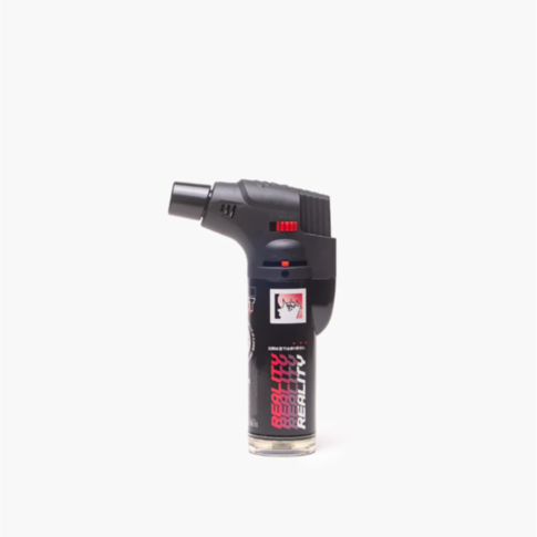 The Special Blue - Berni Torch Lighter is a black handheld torch with a single flame, trigger, and safety lock. It stands upright against a plain white background and has REALITY labeled on the canister.