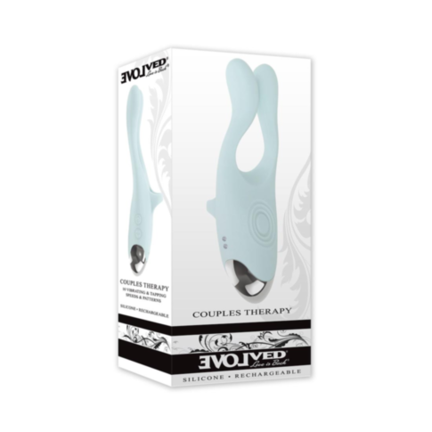 A white box holds the Evolved-Sil Rechargeable Couples Therapy-Mint vibrator. Crafted from silicone and rechargeable, it promises enhanced experiences. The packaging features a subtle floral pattern reminiscent of delicate vibrating antennae.