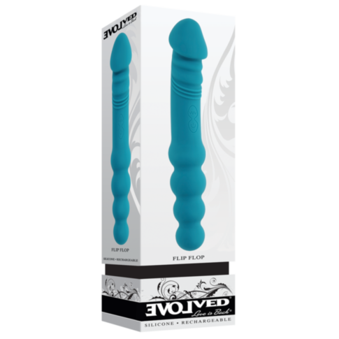 The Evolved- Sil Rechargeable Flip Flop-Teal is a teal silicone vibrator with a textured, ribbed shaft standing upright beside its packaging, featuring the Evolved brand. This dual-sided vibe is fully submersible for versatile pleasure.