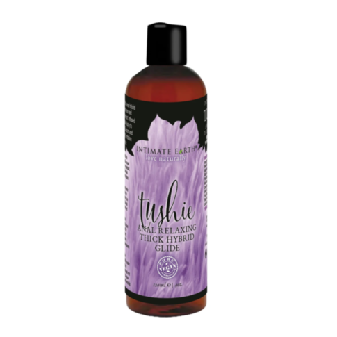 A 120 ml (4 fl. oz.) bottle of TUSHIE 4OZ HYBRID ANAL RELAX GLIDE with a relaxing hybrid formula for comfortable anal play, featuring a purple feather label and a sleek black cap.