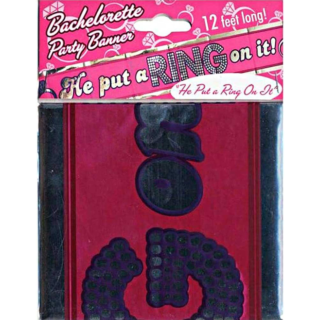 The Put A Ring On It Party Banner announces He put a RING on it! stretching 12 feet with a playful pink background and white polka dots, perfect for bachelorette celebrations.