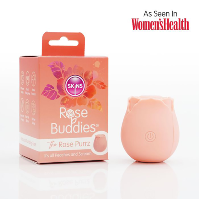 A Skins Rose Buddies-The Rose Purrz-Nude device in a peach color is shown along with its floral-designed packaging. The box displays the Skins brand and includes text reading, "As Seen In Women's Health.