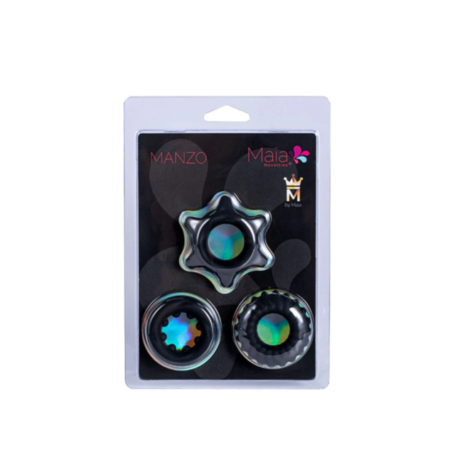 The packaging consists of three black metallic components with iridescent centers, all neatly housed in a clear plastic casing. The Maia-Manzo brand name and a crown logo adorn the top, embodying the luxury akin to the premium Maia-Manzo 3pc Cockring Set 