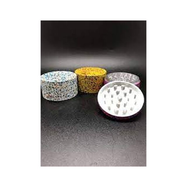 A vibrant splatter design adorns the 2in 4pc Aluminum Grinder in assorted colors, showcasing a green square with a white rocket icon surrounded by stars. Above this dynamic graphic, the words "No Image" are gracefully inscribed in white.
