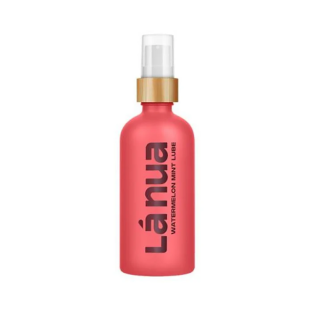 The Watermelon Mint Lubricant spray bottle showcases a pink body, white pump nozzle, and wooden-look collar with Lánua printed vertically in black on the front, emphasizing its water-based natural moisturizer formula for a smooth and refreshing experience