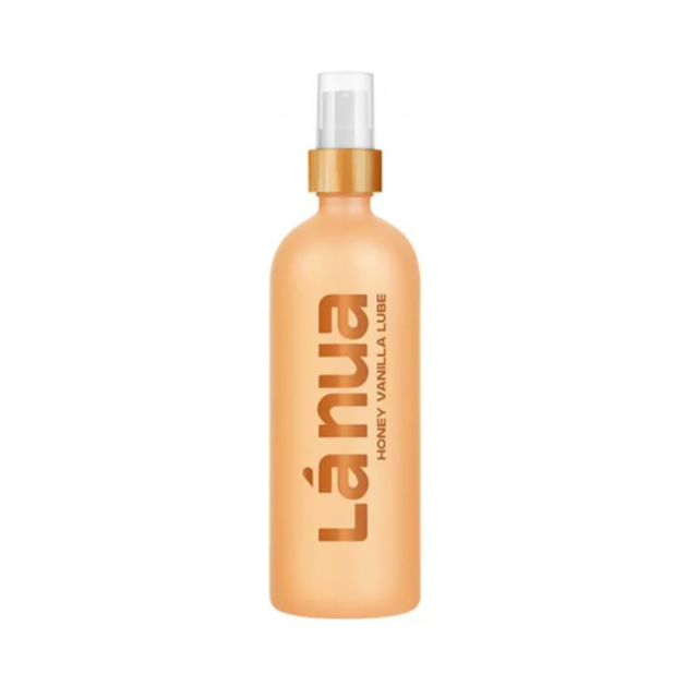 The Honey Vanilla Water-Based Lubricant, 200 ml (6.8oz), features a spray nozzle in a warm amber bottle with bold vertical text, offering dual benefits as a natural moisturizer.