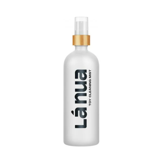 White, fragrance-free spray bottle with a wooden cap labeled “Mist Toy Cleaner-6.8oz.”.