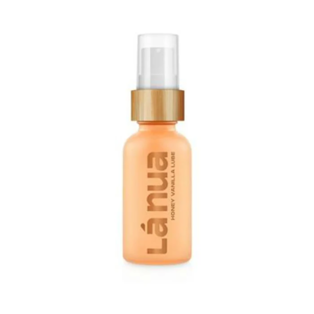 The Lánua Honey Vanilla Water-Based Lubricant-1oz comes in an orange bottle with a sleek wooden cap and minimalist label. The pump dispenser provides easy application, while its natural formula serves as both a lubricant and moisturizer for enhanced comfo