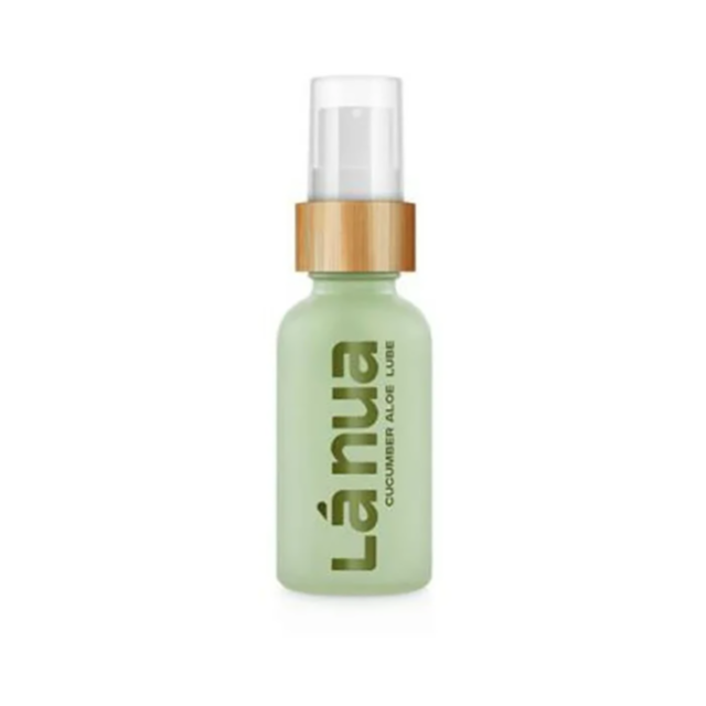 A small, green spray bottle with a wooden cap is labeled Lánua and contains the Cucumber Aloe Water-Based Lubricant-1oz. The translucent packaging reveals its liquid contents, offering gentle hydration and comfort as a refreshing natural moisturizer.
