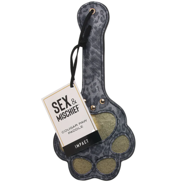 A Cougar Paw Paddle crafted from faux leather, designed to resemble a cougar paw with a striking leopard print. It comes with a label that reads "Sex & Mischief: Cougar Paw Paddle" and includes a black strap, perfect for those who enjoy impact play.
