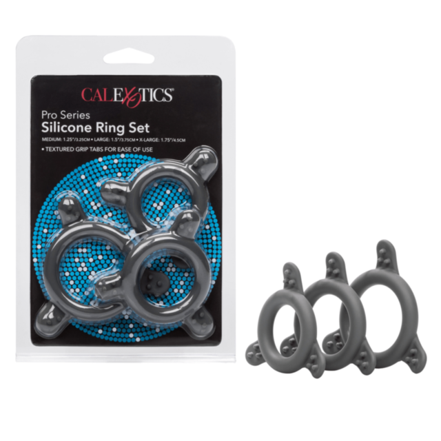 The illustration, set against a green background, showcases a gray rocket encircled by the Cal Exotics Pro Series Sil. Ring Set, made from ultra-durable silicone. The rocket is pointed upwards with small stars surrounding it, and the words No Image are di