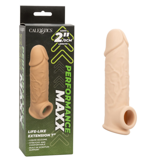 Resting beside its Performance Max Life packaging is the Cal Exotics-Performance Max Life Like Ext 7in-Ivory, a silicone extension in a natural ivory hue. Crafted from premium liquid silicone, it offers an additional 2 inches/5 cm in length and features a
