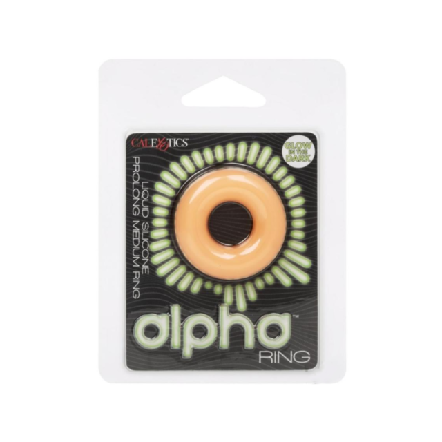 Set against a green background, the Cal Exotics-Alpha GITD Liq Sil Prolong Med Ring features a glow-in-the-dark effect with a gray silhouette of a rocket soaring through a circular space, complemented by shining stars. The phrase "No Image" appears elegan