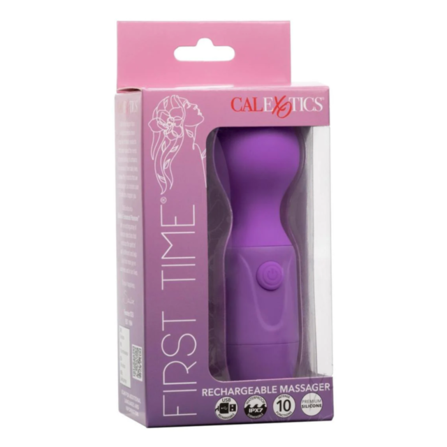 The image displays the Cal Exotics-First Time Rechargeable Massager in purple, featuring intense vibrations next to its packaging. The package is pink with white illustrations and text that reads "First Time" and "CalExotics." This massager includes a rou