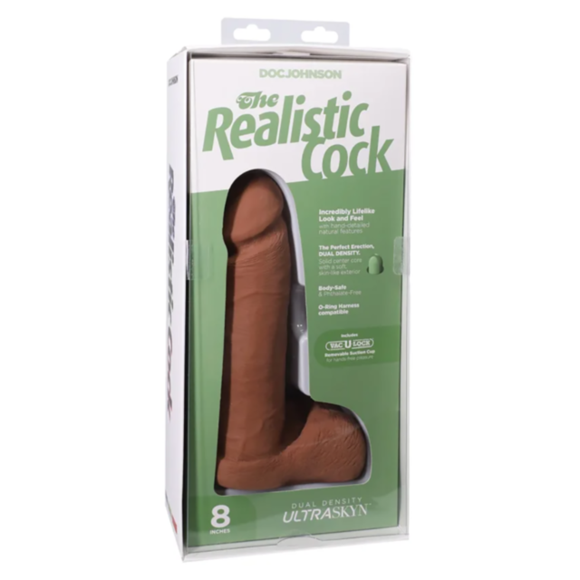 The image showcases The Realistic Cock Ultraskyn w VUL 8in-Caramel, an 8-inch dual-density dildo in caramel. The packaging highlights features such as an ultra-realistic look and feel, crafted from innovative UltraSkyn material for a lifelike experience.