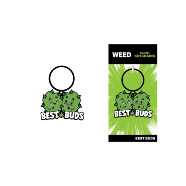 Introducing the Wood Rocket-Best Buds Keychain: A charming green enamel piece featuring two delightful cartoon cannabis leaves with smiling faces, labeled "BEST BUDS." Perfect for fans of 420 pride, it comes in vibrant packaging highlighted by a burst des