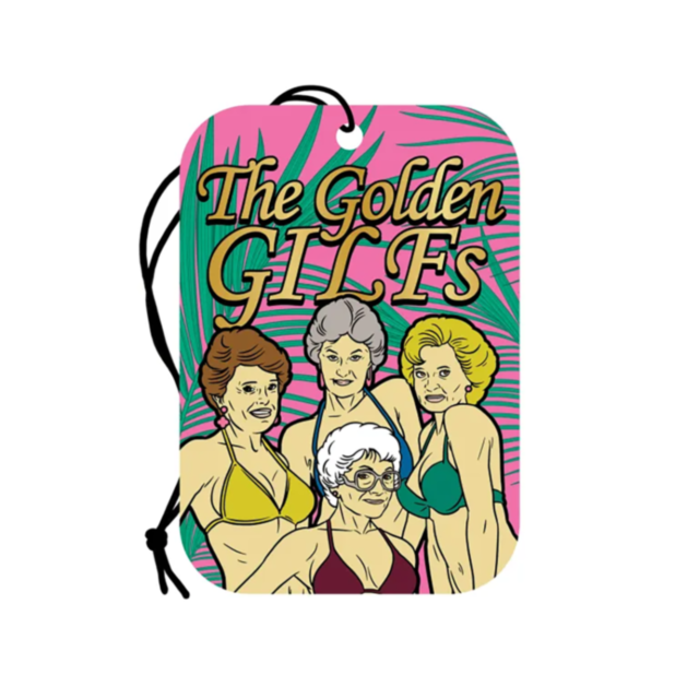 Wood Rocket-Air Freshener-Golden GILFs releases a refreshing rose fragrance and showcases an illustration of four women in bikinis with "The Golden GILFs" text set against a backdrop of pink and green palm leaves. It comes with a black string for convenie