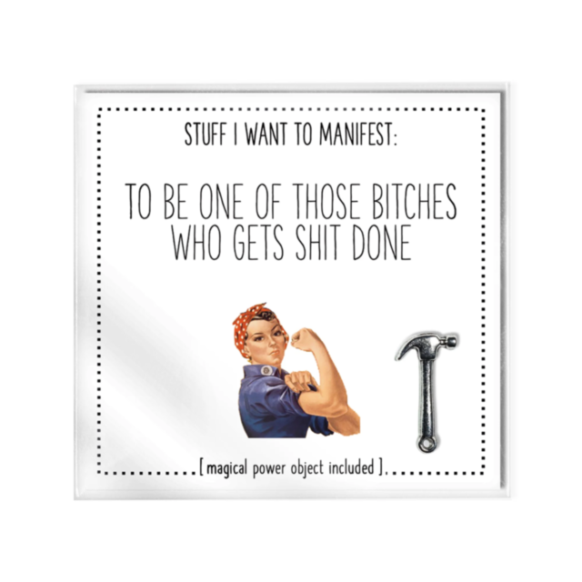 A motivational card titled "To Be One Of Those Bitches That Gets Shit Done" showcases a vintage illustration of a strong woman in work attire flexing her arm. It features bold text and a hammer graphic, accompanied by a charm for ultimate motivation.