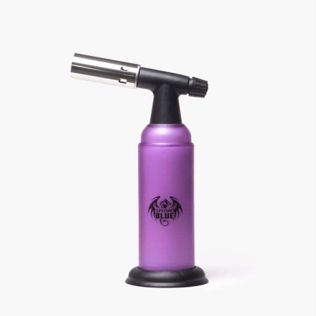 The Special Blue - Monster - Purple is a fully metal butane torch with a black nozzle and base, featuring a dragon logo and Special Blue on the front, shown against a plain white background.