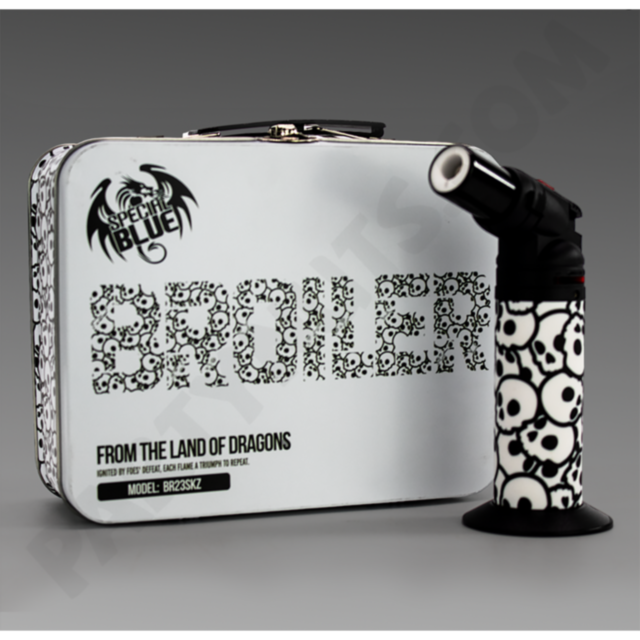 A Special Blue - Skulls metal lunchbox and handheld torch, both featuring bold black-and-white skulls and Specter Blue Broiler text, combine striking style with flame-inspired flair.