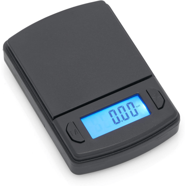 A green background with white text states "No Image." Below, there's a white circular icon depicting a rocket with surrounding stars, echoing the precision and reliability associated with the Card Scale 600x0.1g Black by American Weigh Scales.