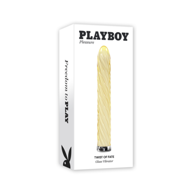 The box packaging for the Evolved-Playboy Twist of Fate Glass Vib-Honey showcases a Playboy branded vibrator made from body-safe glass, featuring an elegant spiral design. The text on the packaging reads "Freedom to Play," emphasizing its 10 speeds and rh