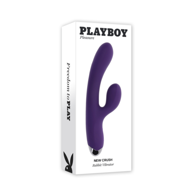 A white box labeled Evolved-Playboy Sil Rechargeable New Crush Rabbit-Purple displays a purple dual-arm, body-safe silicone vibrator. The box features “New Crush Rabbit Vibrator” and the Playboy bunny logo on the side.