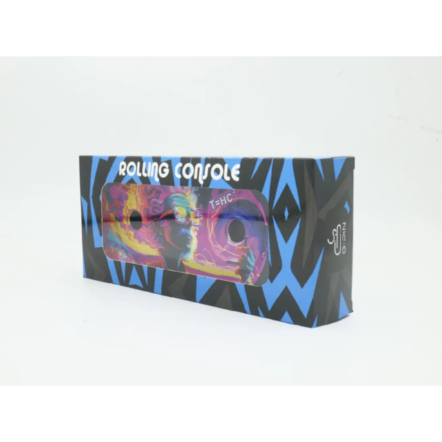 Introducing the Small Rolling Console Tray with Stand and Accessories, featuring a vibrant psychedelic design in shades of blue and pink with the acronym T+HC. The packaging showcases a stylized character and graphic patterns against a white background, m