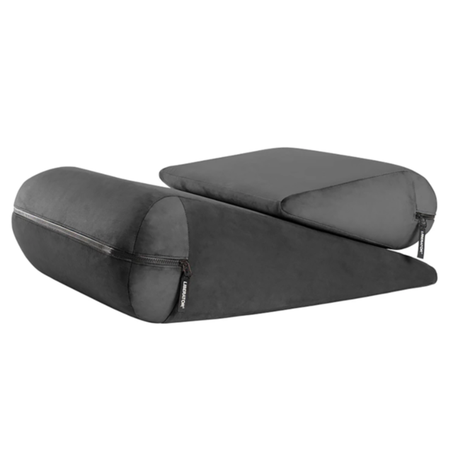 A pair of dark gray wedge-shaped cushions comes with zippered covers. The Liberator Jaz Duet-Jaz & Jaz Ramp Combo Liberty-Black features a cylindrical cushion on top of a triangular base, offering both functionality and comfort. Designed with a Velvish Ex