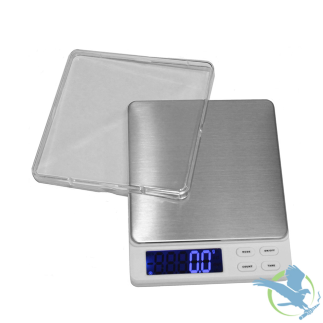Introducing the WC 200 Scale 2000g X 0.1, a digital kitchen scale that boasts a stainless steel platform complemented by a clear plastic cover. It is equipped with an LCD display that shows weights starting from 0.0 g, and features buttons for mode select